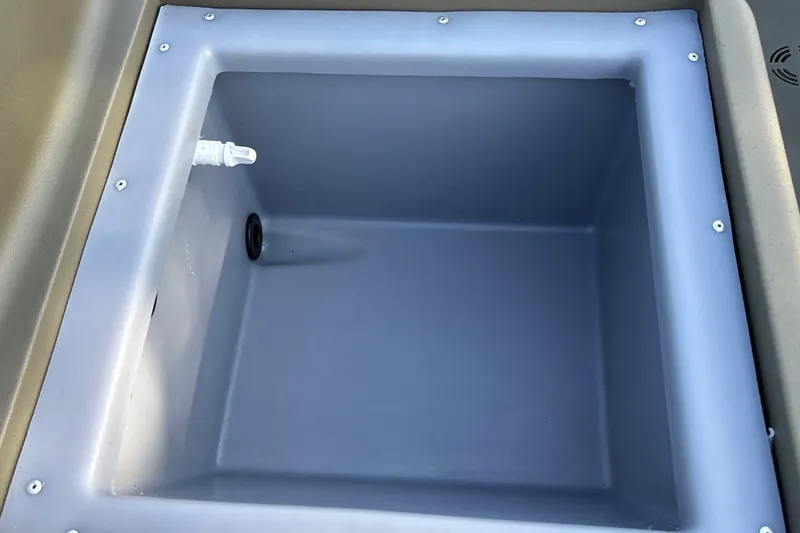 Slide: The Image of Livewell compartment of 2026 Tracker Grizzly 1754 SC boat, featuring durable construction. - 17