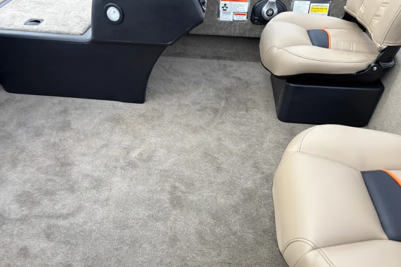 Slide: The Image of Interior of 2026 Tracker Bass Tracker Classic Limited boat with beige seats and carpet. - 22