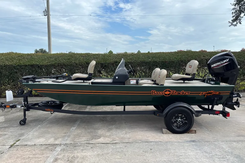 The Image of 2026 Tracker Bass Tracker Classic Limited fishing boat with Mercury engine on trailer. - 0