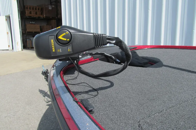 Slide: The Image of Trolling motor on a 2026 Nitro Z17 boat, parked near a warehouse. - 101