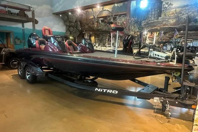 Slide: The Image of 2026 Nitro Z21 XL boat displayed indoors with red seating and sleek design. - 1