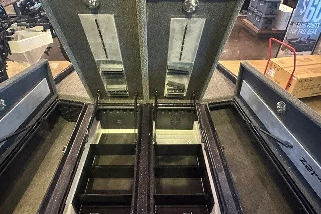 Slide: The Image of 2026 Nitro Z21 XL boat storage compartments with organized shelving and secure locks. - 9