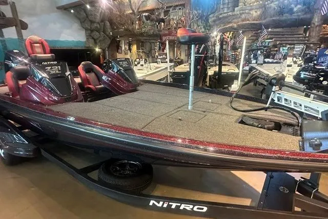Slide: The Image of 2026 Nitro Z21 XL boat displayed indoors, featuring spacious deck and dual seating. - 4