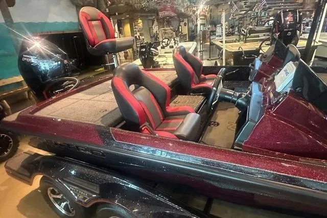 Slide: The Image of 2026 Nitro Z21 XL boat with red and black seating, displayed indoors. - 3