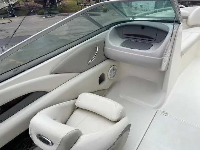 Slide: The Image of Interior of a 2006 Chaparral 210 SSi boat with white leather seats. - 12