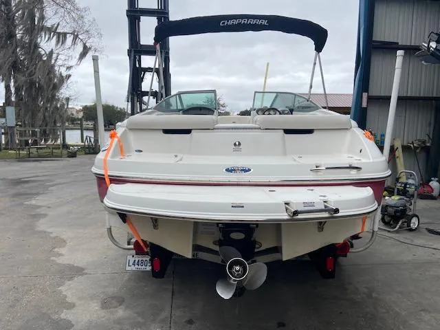 Slide: The Image of Rear view of a 2006 Chaparral 210 SSi boat at a dock. - 5