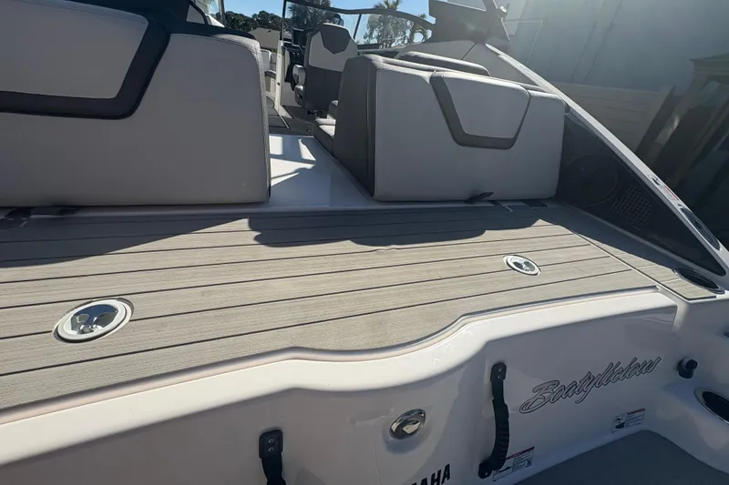 Slide: The Image of 2025 Yamaha Boats AR250 interior with sleek seating and modern design. - 18