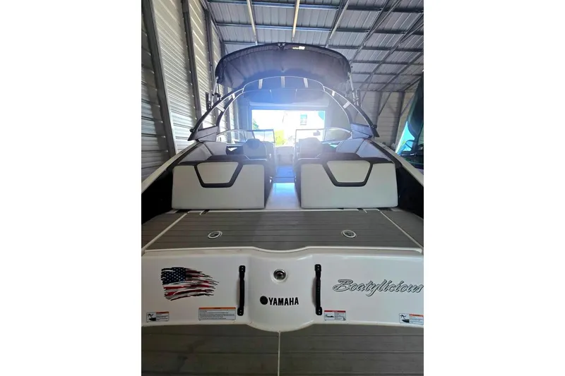 Slide: The Image of 2025 Yamaha Boats AR250 interior with spacious seating and modern design. - 7