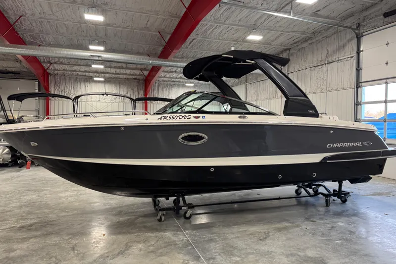 Slide: The Image of 2020 Chaparral 257 SSX boat in a warehouse, side view. - 1