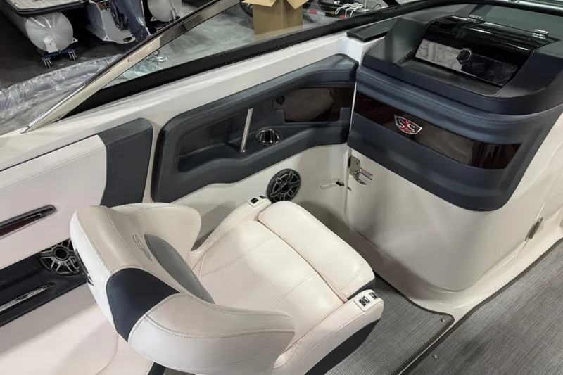 Slide: The Image of 2020 Chaparral 257 SSX boat interior with sleek seating and modern dashboard design. - 14