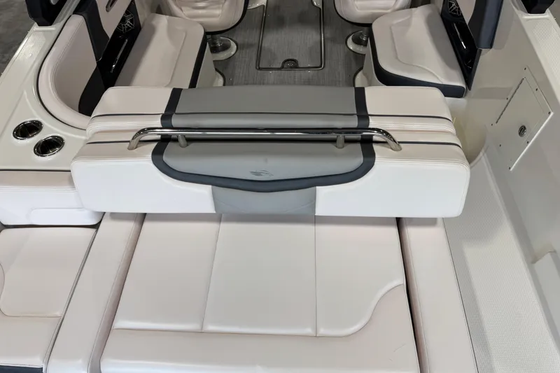 Slide: The Image of 2020 Chaparral 257 SSX boat interior with white seating and stainless steel accents. - 5