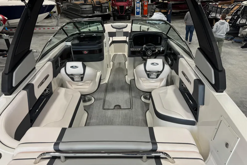 Slide: The Image of 2020 Chaparral 257 SSX boat interior with luxurious seating and modern dashboard. - 6
