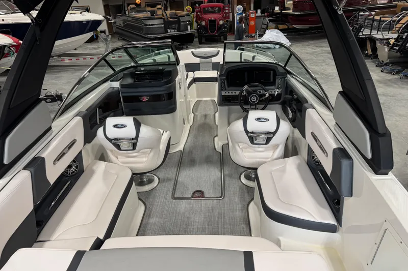 Slide: The Image of 2020 Chaparral 257 SSX boat interior with luxurious seating and modern dashboard. - 8