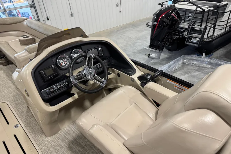 Slide: The Image of 2019 Avalon 2585 Catalina boat interior with steering wheel and control panel. - 13