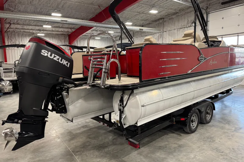 Slide: The Image of 2019 Avalon 2585 Catalina pontoon boat with Suzuki outboard motor in a showroom. - 5