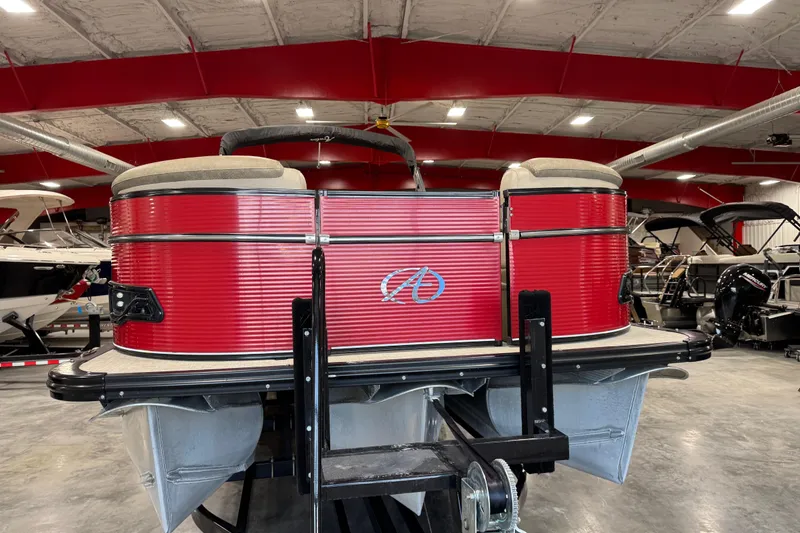 Slide: The Image of 2019 Avalon 2585 Catalina pontoon boat with red exterior in a showroom. - 6