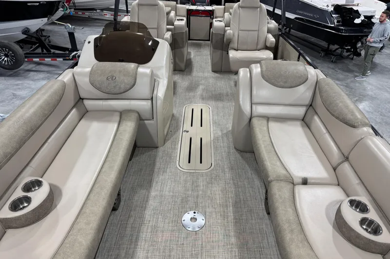 Slide: The Image of 2019 Avalon 2585 Catalina pontoon boat interior with beige seating and cup holders. - 8