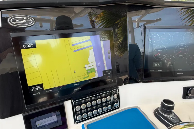Slide: The Image of Dashboard of 2022 Sea Fox 328 Commander with Garmin navigation displays. - 13