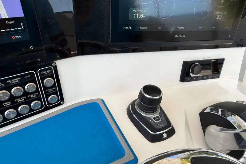Slide: The Image of Control panel of 2022 Sea Fox 328 Commander with navigation screens and joystick. - 16