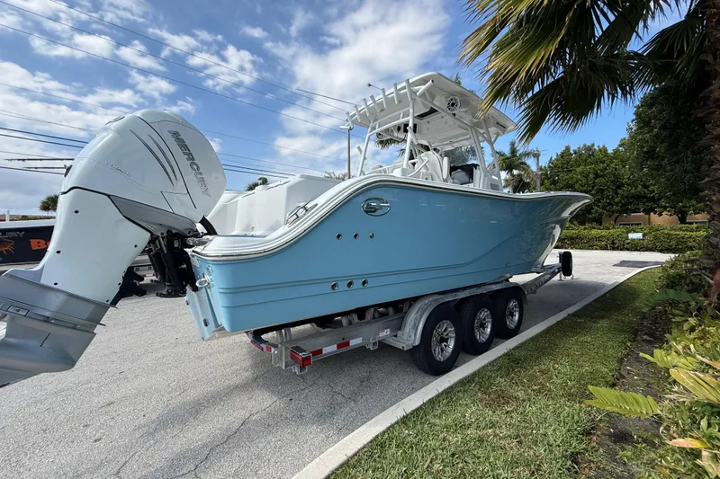 Slide: The Image of 2022 Sea Fox 328 Commander boat on trailer with Mercury outboard engine. - 2