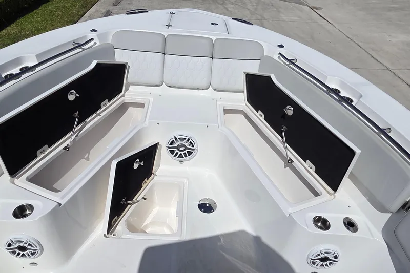 Slide: The Image of 2022 Sea Fox 328 Commander boat interior with open storage compartments and seating. - 22