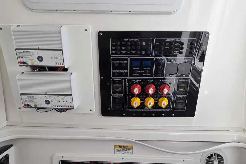 Slide: The Image of Control panel of a 2022 Sea Fox 328 Commander boat with circuit switches and indicators. - 24
