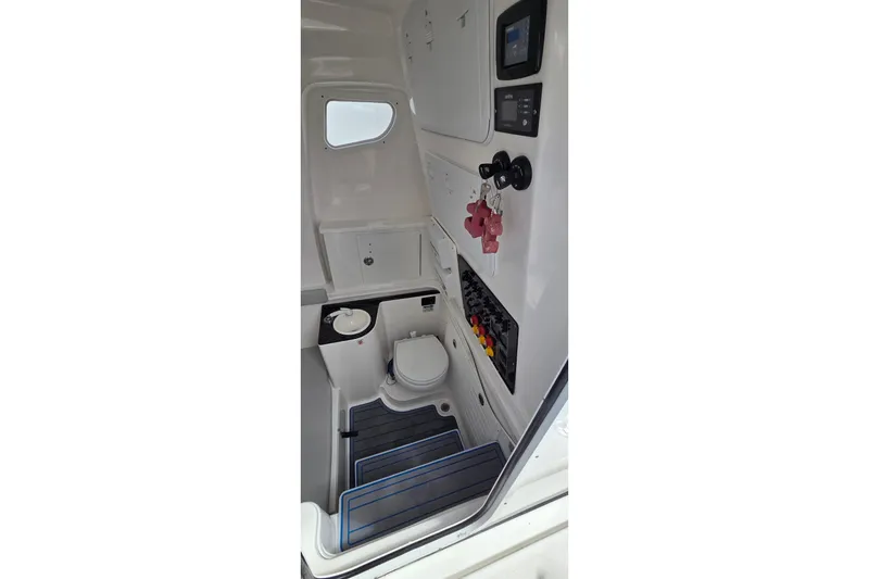 Slide: The Image of 2022 Sea Fox 328 Commander boat interior with toilet and control panel. - 27
