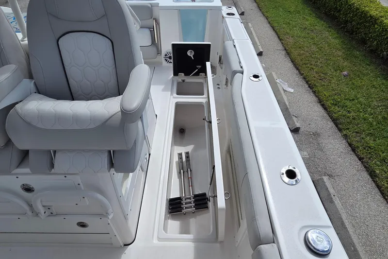Slide: The Image of 2022 Sea Fox 328 Commander boat interior with storage compartment and seating. - 28