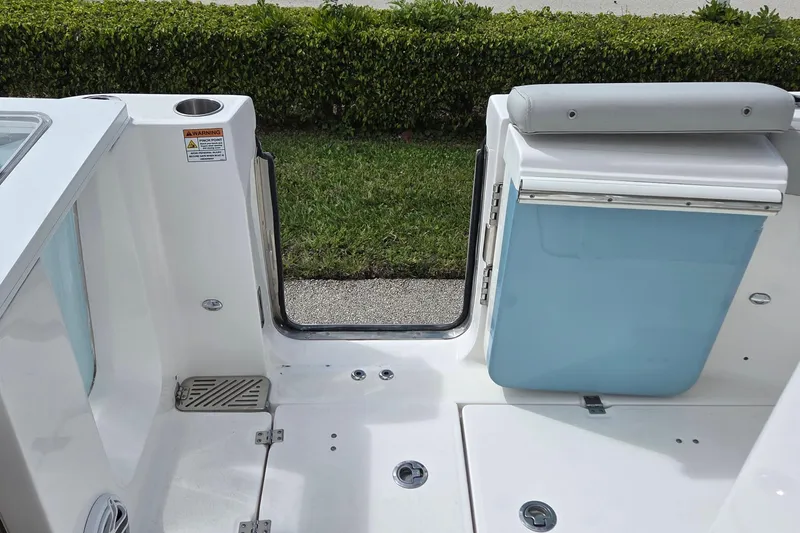 Slide: The Image of 2022 Sea Fox 328 Commander boat interior with seating and storage compartment. - 31