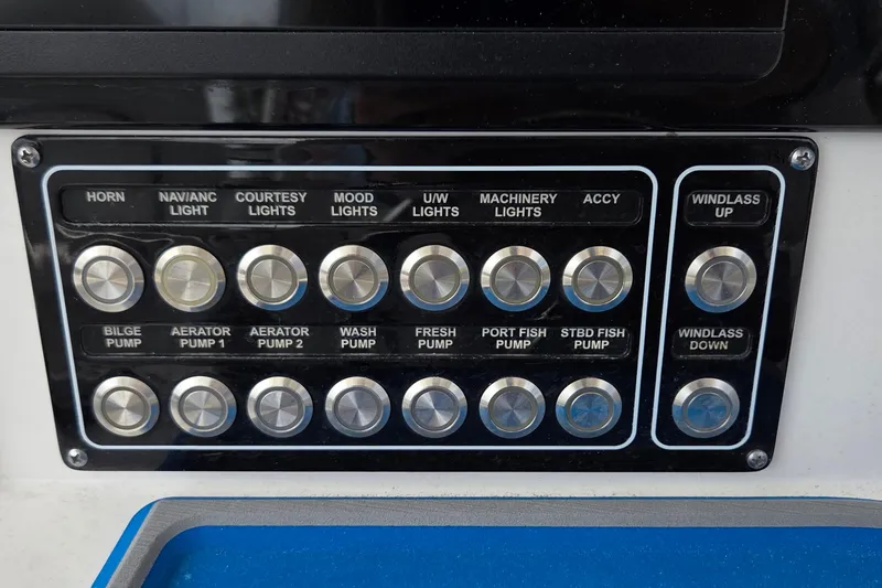 Slide: The Image of Control panel of a 2022 Sea Fox 328 Commander boat with labeled buttons. - 33