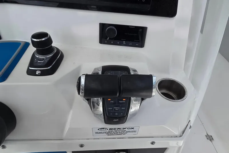 Slide: The Image of 2022 Sea Fox 328 Commander boat controls with joystick and throttle. - 34