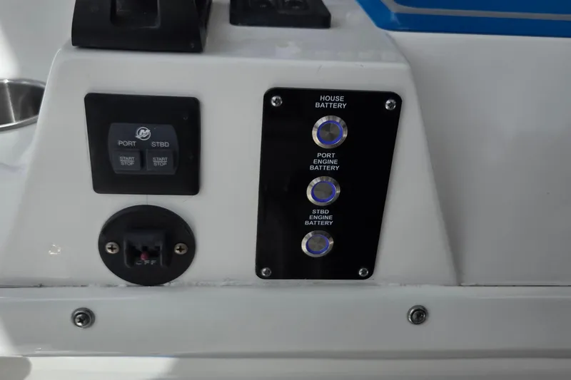 Slide: The Image of Control panel of 2022 Sea Fox 328 Commander boat, featuring battery switches and start/stop buttons. - 35