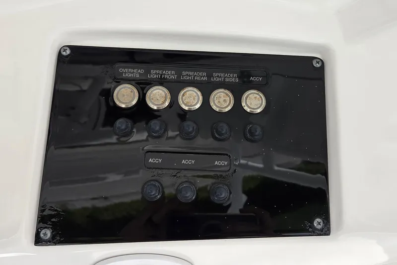 Slide: The Image of Control panel of 2022 Sea Fox 328 Commander boat with labeled switches. - 36