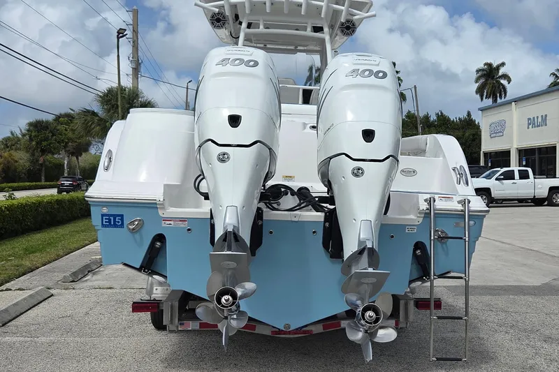 Slide: The Image of 2022 Sea Fox 328 Commander with twin 400 horsepower engines, parked outdoors. - 40