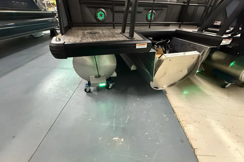 Slide: The Image of 2025 Viaggio Z22S pontoon boat with green LED lights and modern design. - 34