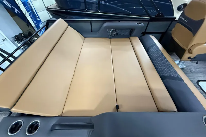Slide: The Image of Luxurious tan and black seating in 2025 Viaggio Z22S boat interior. - 38
