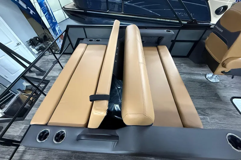 Slide: The Image of 2025 Viaggio Z22S boat interior with tan seating and cup holders. - 39