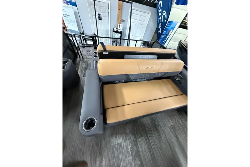 Slide: The Image of 2025 Viaggio Z22S boat seating with tan upholstery and cup holders. - 40