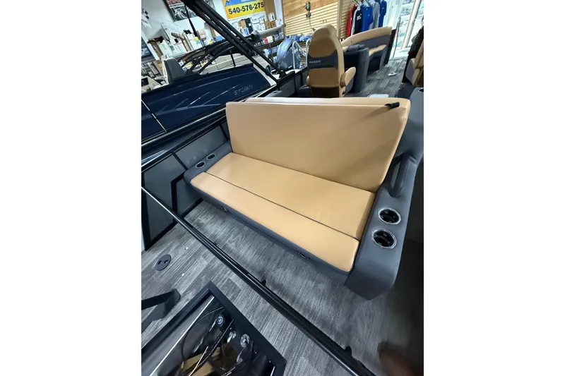 Slide: The Image of 2025 Viaggio Z22S boat interior with tan seating and cup holders. - 41