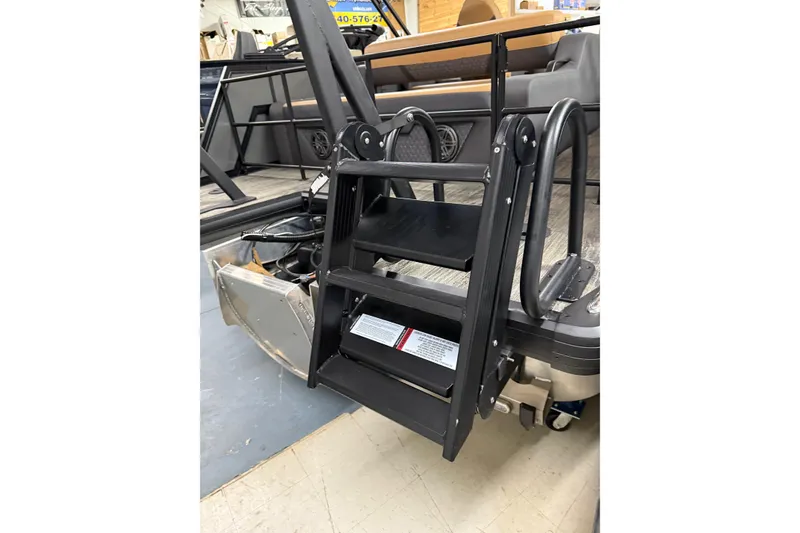 Slide: The Image of 2025 Viaggio Z22S boat with black boarding ladder and interior seating. - 43