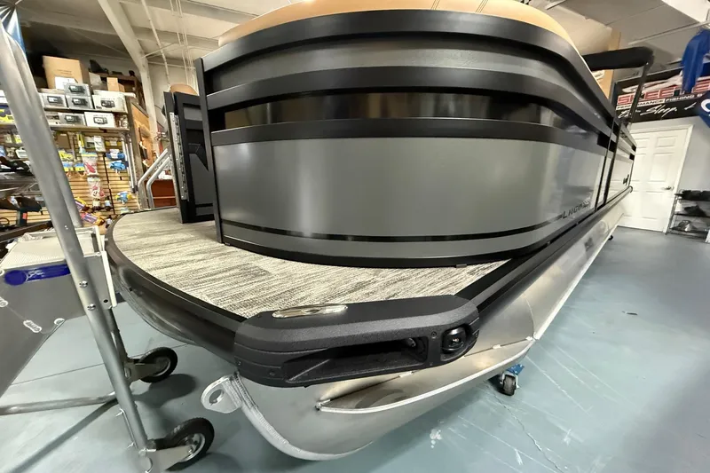 Slide: The Image of 2025 Viaggio Z22S pontoon boat in showroom, showcasing sleek design and modern features. - 5