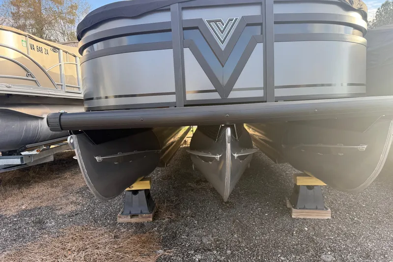 Slide: The Image of 2025 Viaggio Z22S pontoon boat on stands, showcasing sleek design and sturdy pontoons. - 50