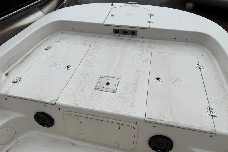 Slide: The Image of 2022 Carolina Skiff 23 LS boat deck with storage compartments and speakers. - 10