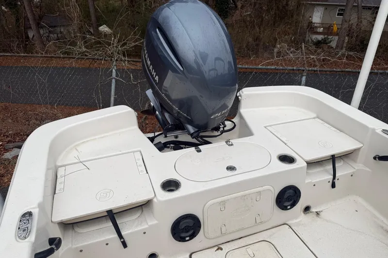 Slide: The Image of 2022 Carolina Skiff 23 LS boat with Yamaha outboard motor, rear deck view. - 4