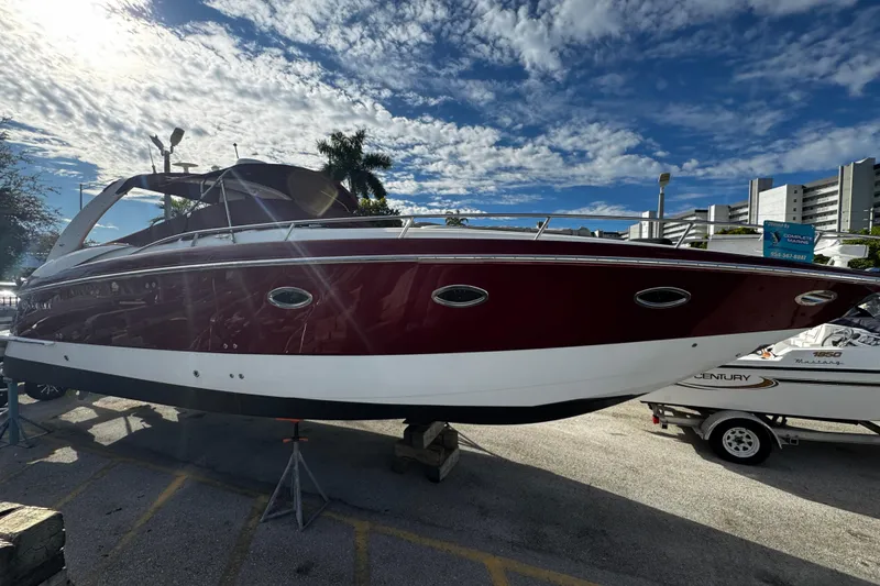 Slide: The Image of 2005 Cobolt 36 boat on display under a bright blue sky. - 1