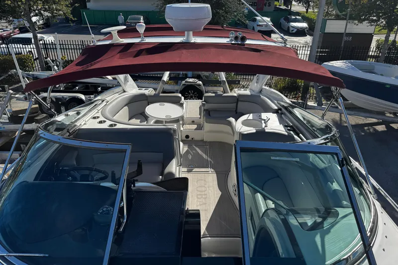 Slide: The Image of 2005 Cobolt 36 boat with red canopy and spacious seating area. - 17