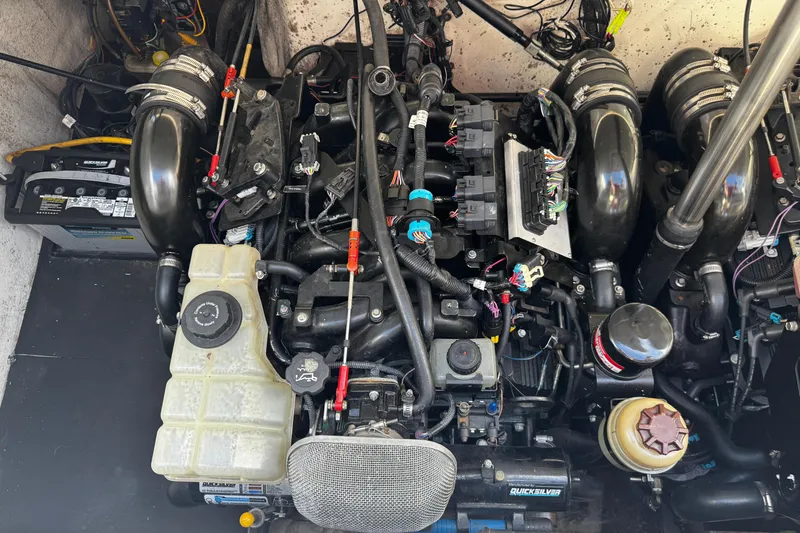 Slide: The Image of Engine compartment of a 2005 Cobolt 36, featuring various components and wiring. - 29