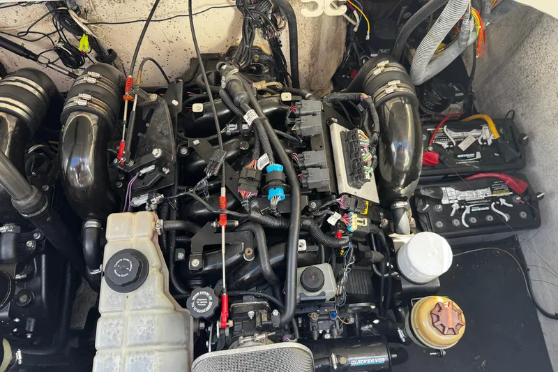 Slide: The Image of Engine compartment of a 2005 Cobolt 36 boat, showcasing wiring and components. - 30