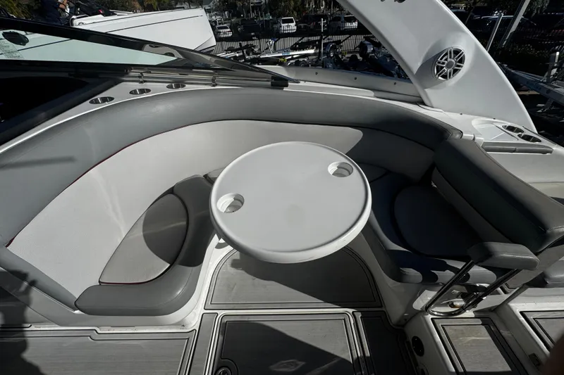Slide: The Image of Luxury seating area on a 2005 Cobolt 36 boat with round table and cup holders. - 7