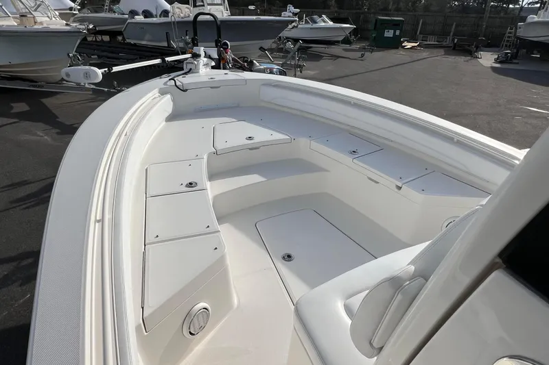 Slide: The Image of 2019 Regulator 26XO boat interior with spacious seating and storage compartments. - 10